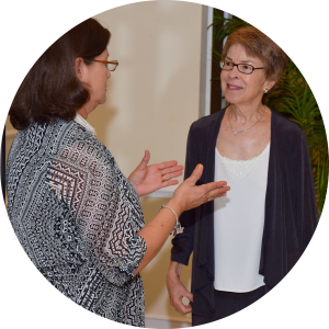 A Walton Options team member talks with an older female consumer about resources.