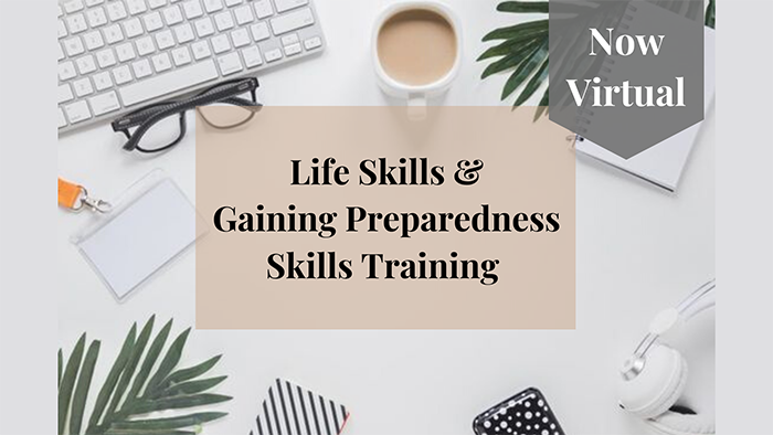 An image of a desk cluttered with plants, glasses, headphones, and a cup of coffee is displayed. In the center of the image sits a rectangular tan box. Inside the box reads "Life Skills & Gaining Preparedness Skills Training." In the upper right-hand corner, a tag hangs that reads "Now Virtual